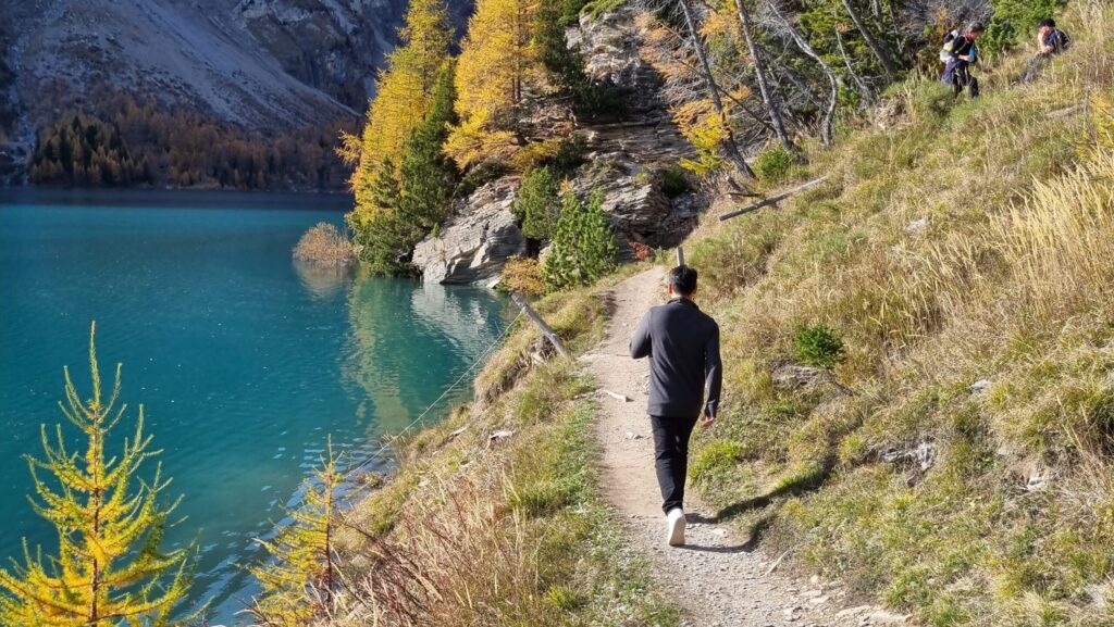 Arturo walking, Tseuzier Lake in autumn, Switzerland
